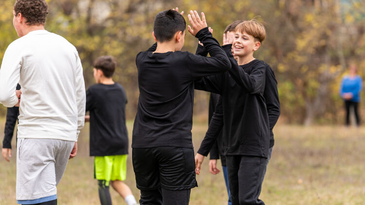 Image of two children giving each other a high-five