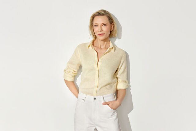 Hand holding the sleeve of a linen shirt